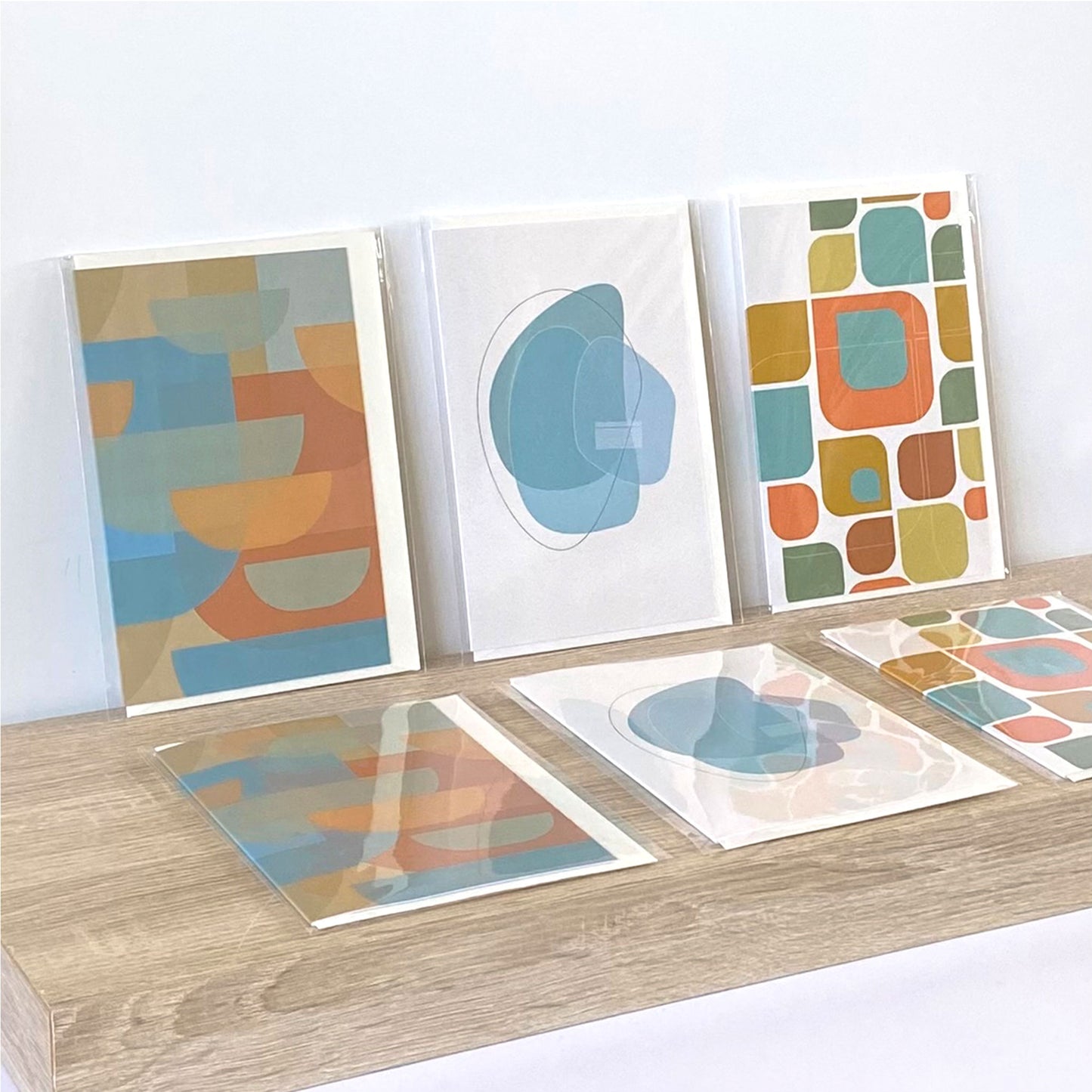 Productafbeelding, foto wenskaarten set "bundel combi-compleet 1 (6x)" in verpakking, de gehele set uitgestald op een presentatieplank