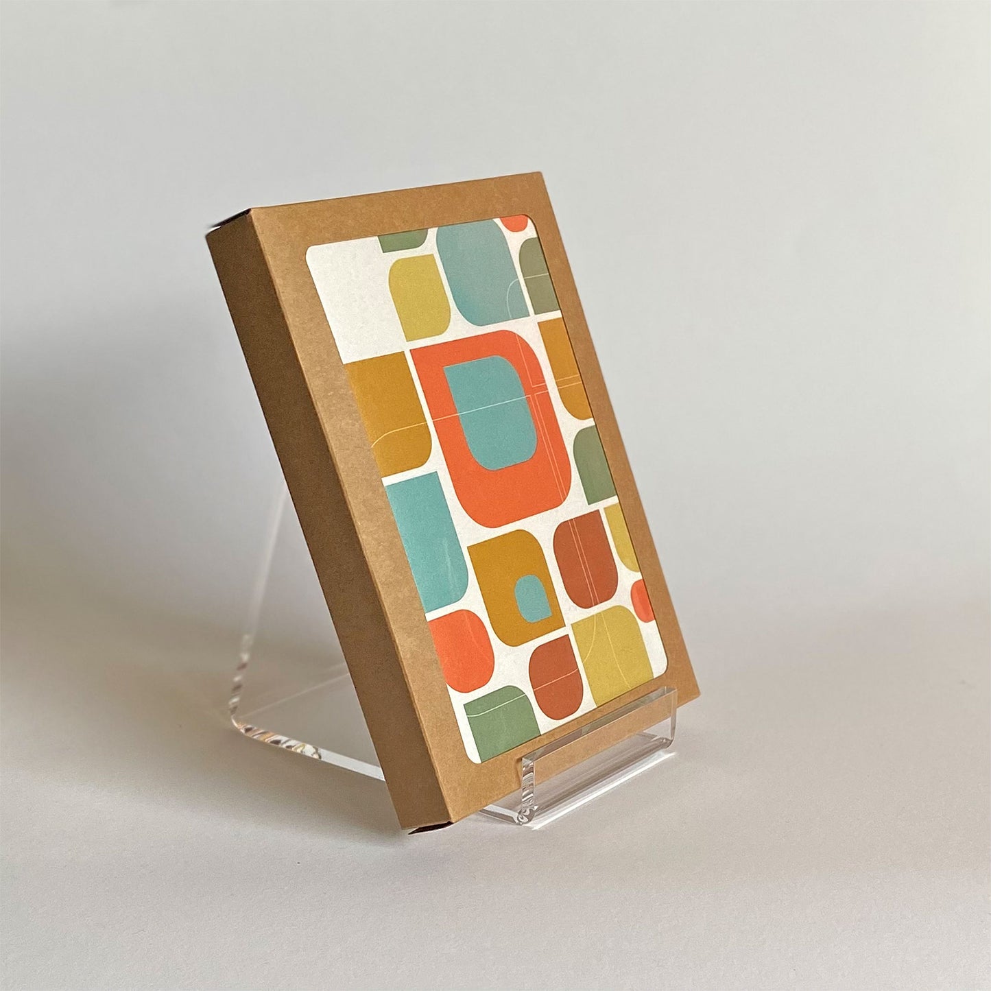 Productafbeelding, foto wenskaart "kleurmotief op wit" gepresenteerd in zijn 10-Pack verpakking