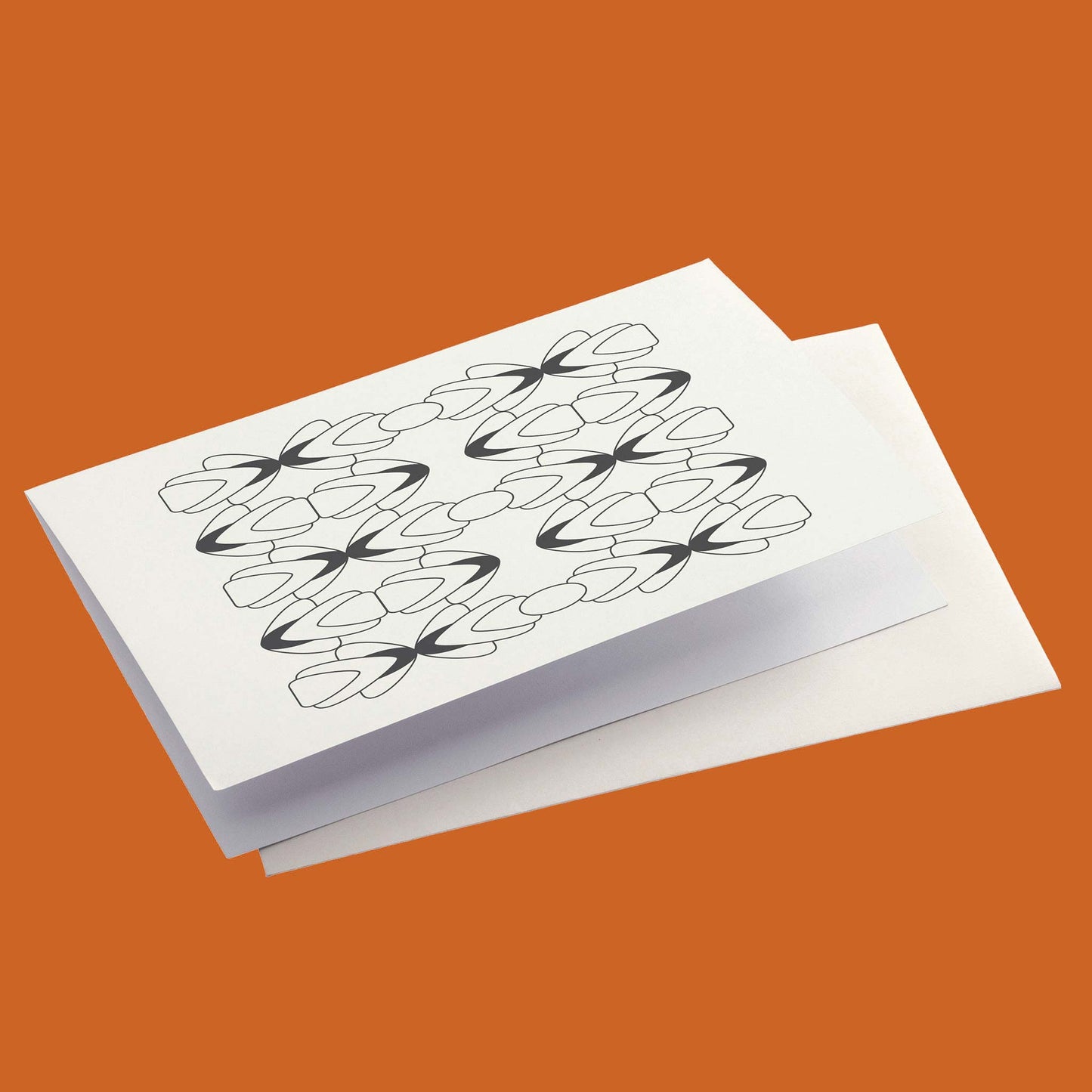 Productafbeelding, foto ontwerp 2 uit de set, gepresenteerd met envelop op een oranje/bruine achtergrond