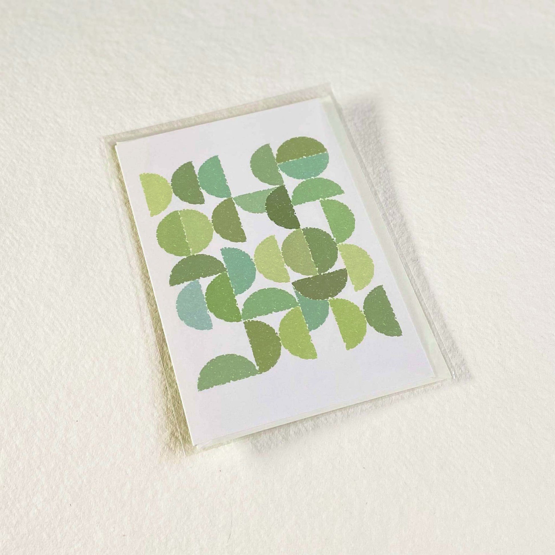 Productafbeelding foto wenskaart "ronde kleuren naar bladgroen" in verpakking